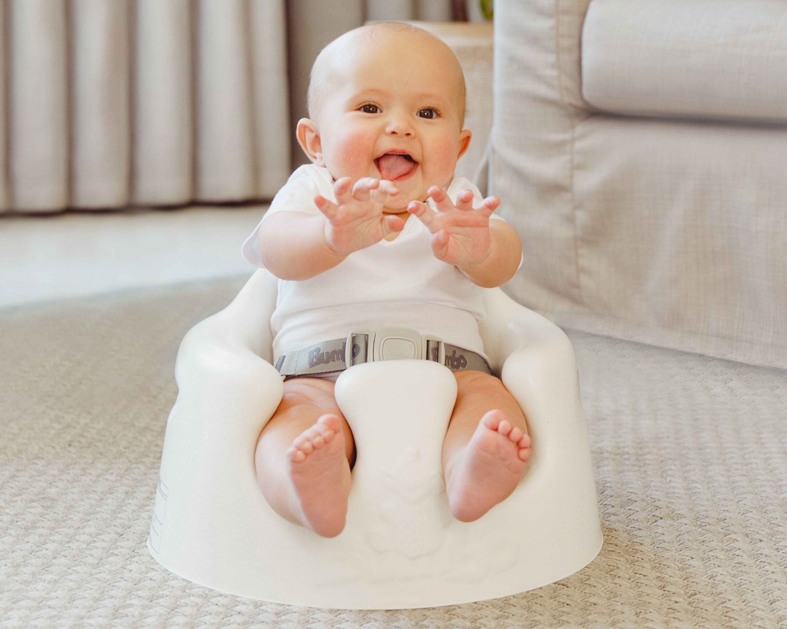 Baby sitting in bumbo seat with bad posture